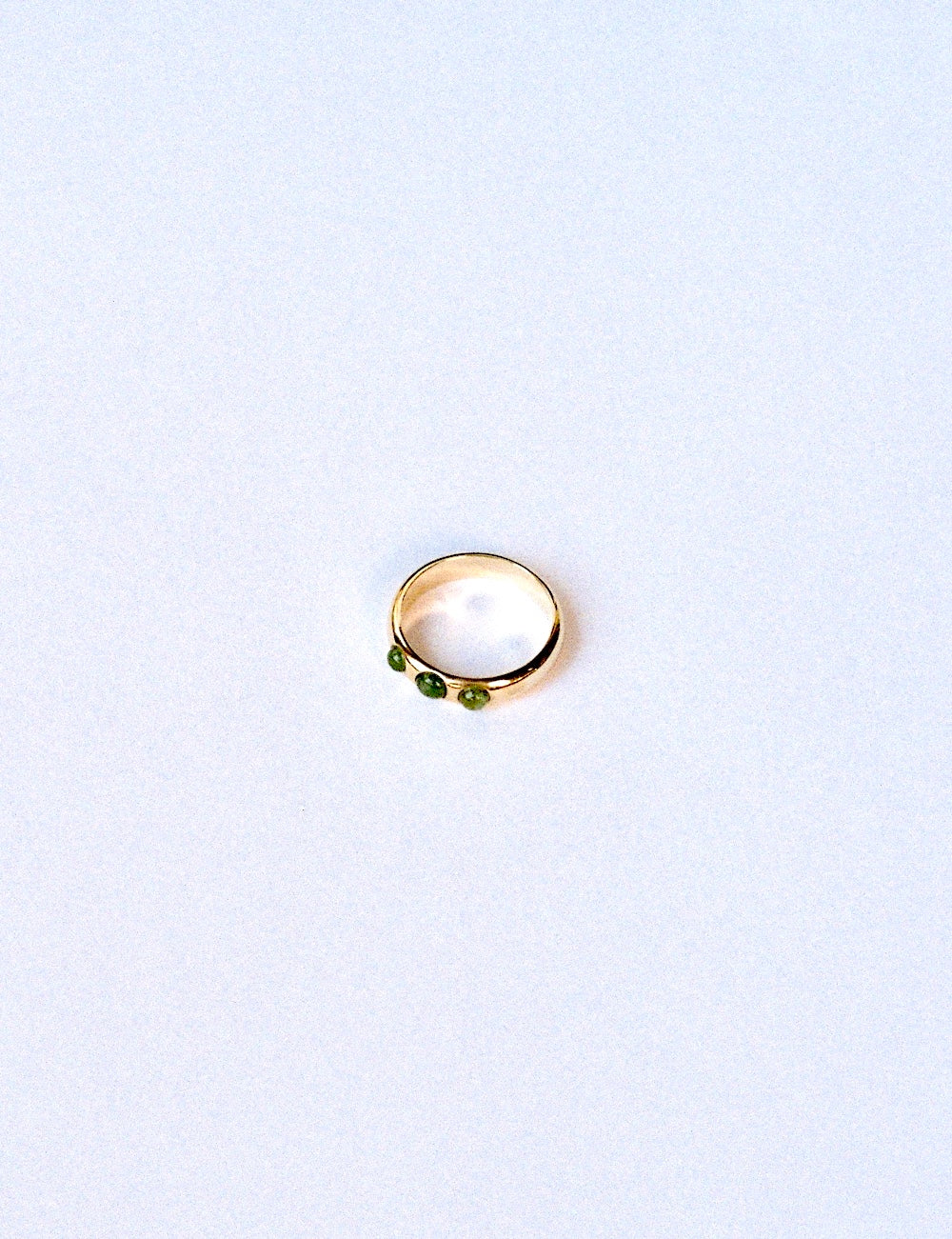 9k gold ring with 3 emeralds