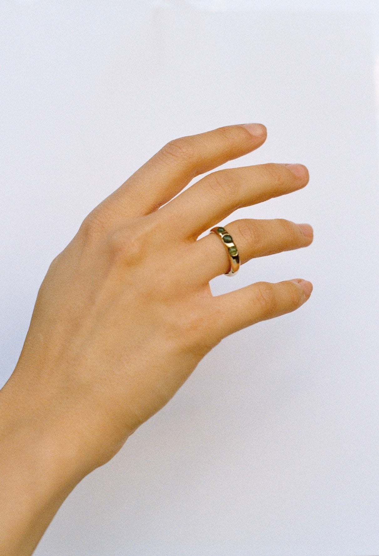 9k gold ring with 3 emeralds